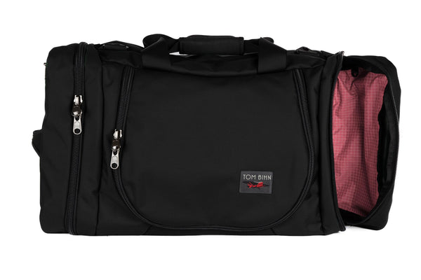 A Black Ballistic Aeronaut 45 with the end pocket open showing the Sakura (pale pink) Halcyon.